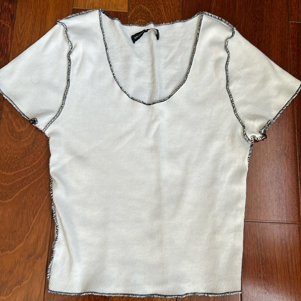 Brandy Melville white top with black accents. Size O/S. Perfect condition.